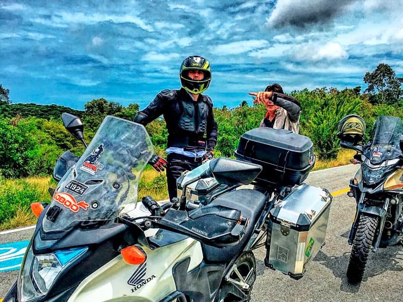 Scenic roadside stop with lush green hills