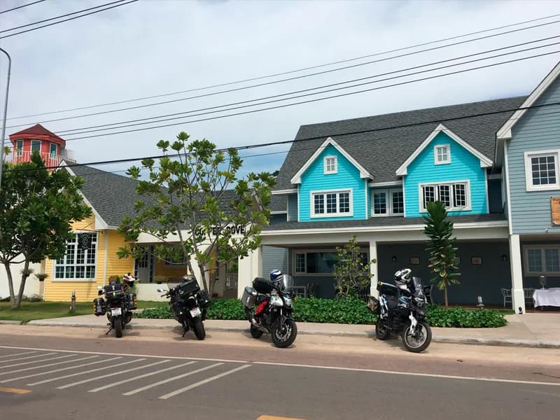 Bikes parked outside colourful coastal buildings