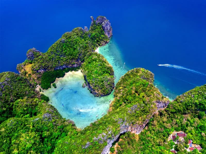 Aerial view of Krabi island with turquoise lagoon and limestone cliffs